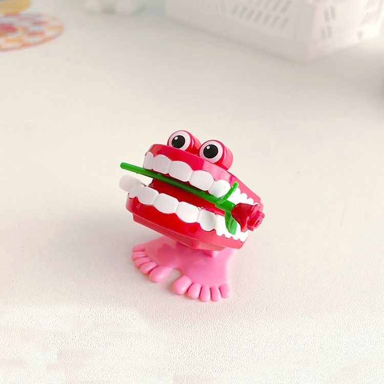 Cute teeth wind up toy