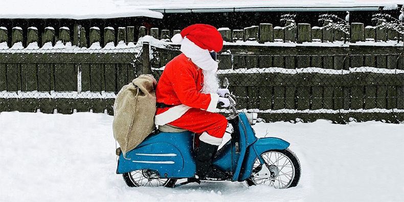 Santa rides in a helmet
